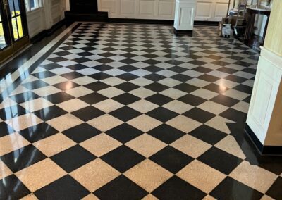 A black and white checkered floor in a hotel lobby